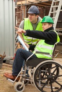 Man in wheelchair working as an architect